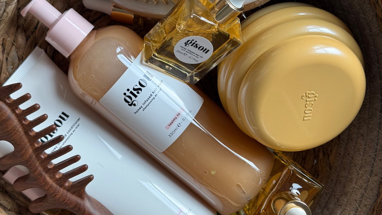The Art of Drawing Readers In: Your attractive post title goes here A stylish arrangement of Gisou hair products in a basket with natural aesthetics.
