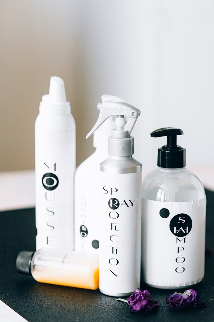 about-01 A stylish arrangement of hair care products in a minimal studio setting, perfect for a clean and modern aesthetic.